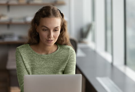 Photo of woman using laptop